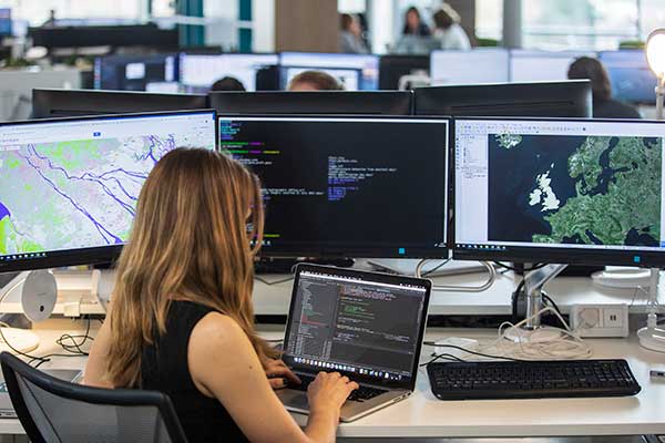 Staff member looking at UK geospatial data