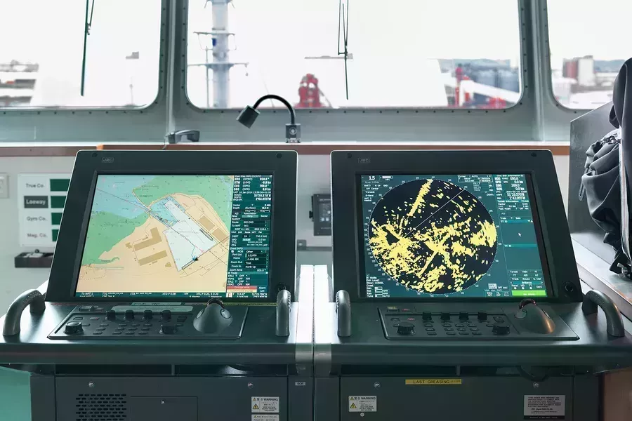 Two ECDIS screens showing navigational charts
