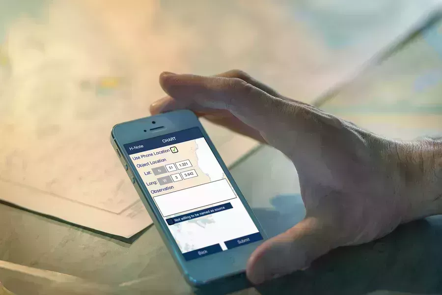 Phone showing ADMIRALTY H-Note App on screen