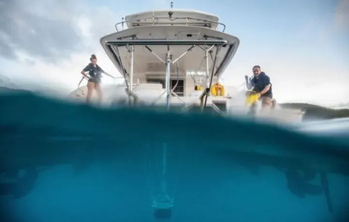 Two hydrographers on a survey boat