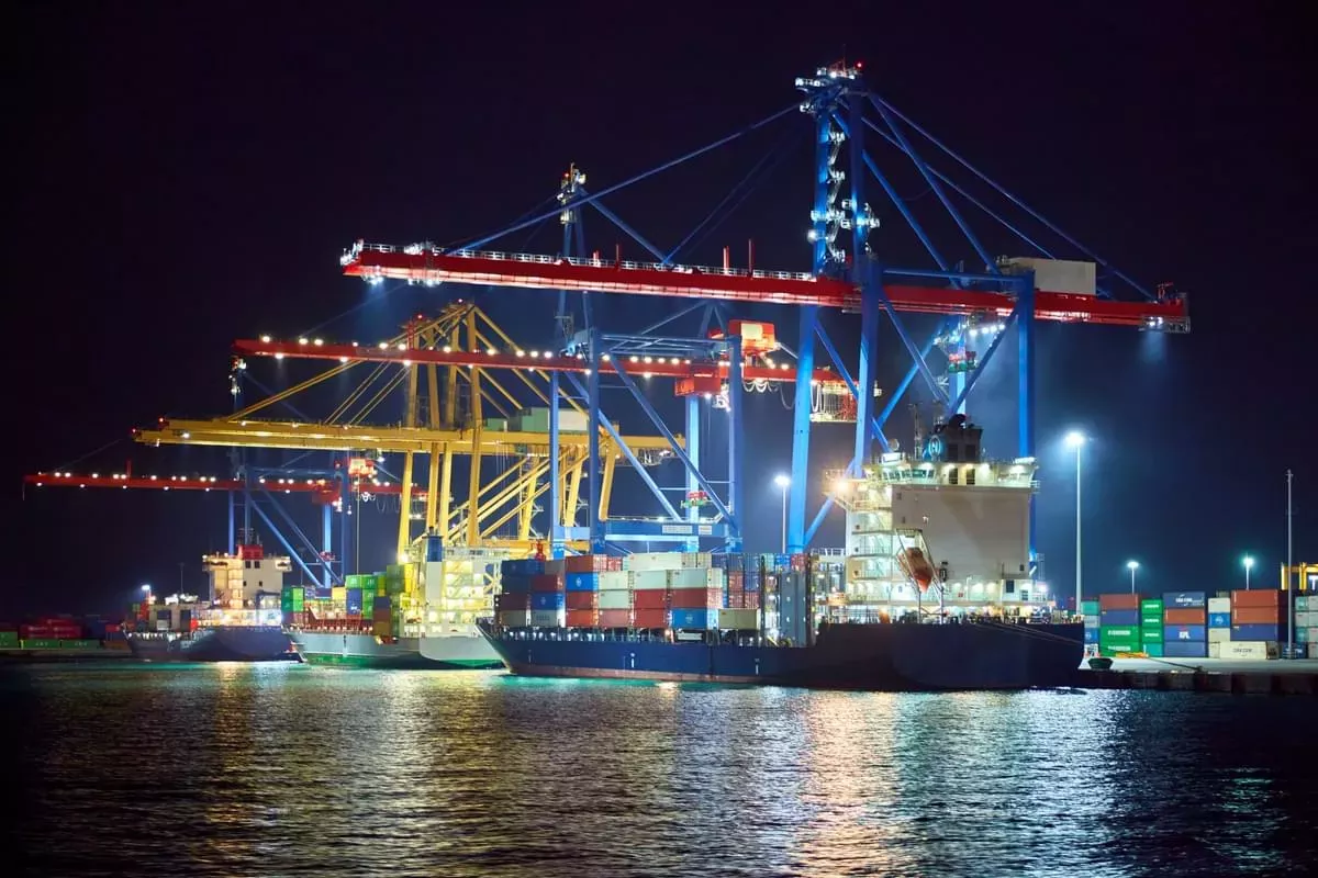Night view of container quayside and cranes.