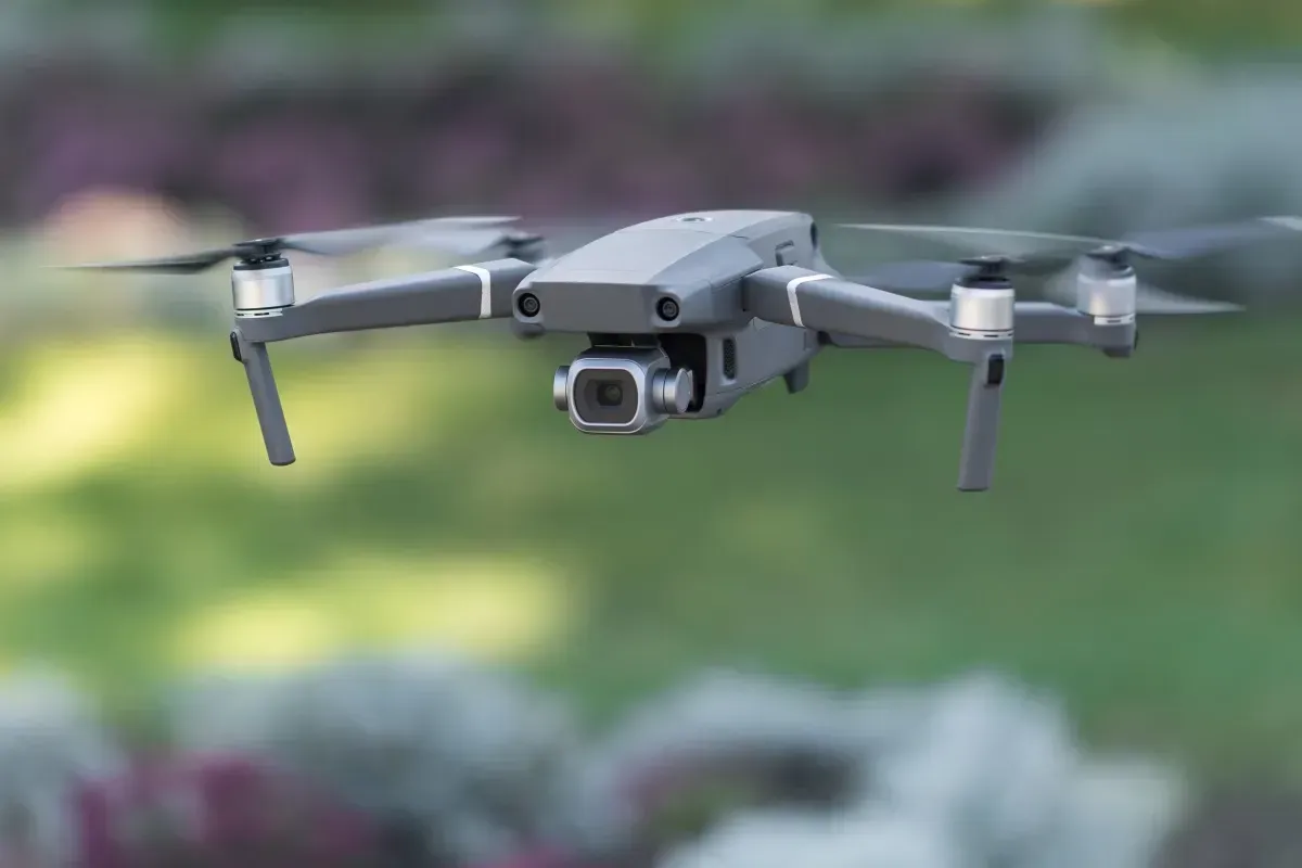 Drone hovering above grass