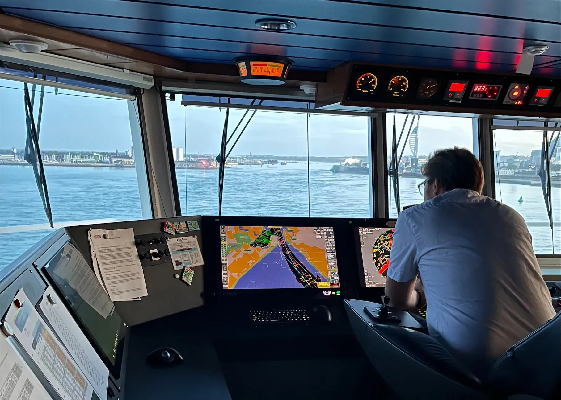 Mariner looking at ECDIS at sea