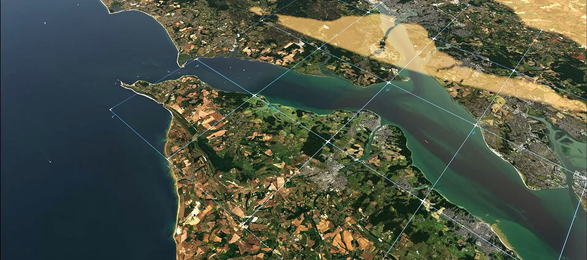 Aerial view of land and sea with data layer visual